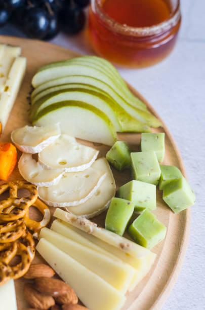 istock Delicious cheese mix with grapes, jam, snacks, crackers, walnuts 1426352579