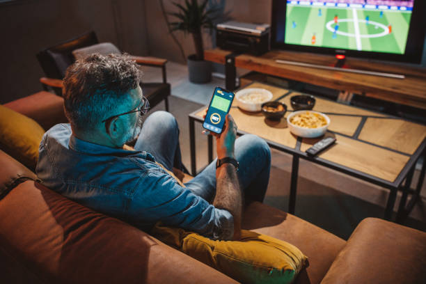 istock Watching soccer game at home 1426353190