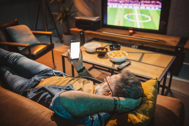 istock Watching soccer game at home 1426353277