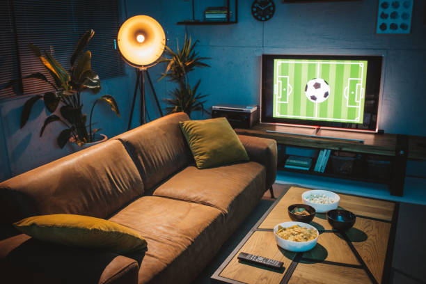 istock Watching soccer game at home 1426353315