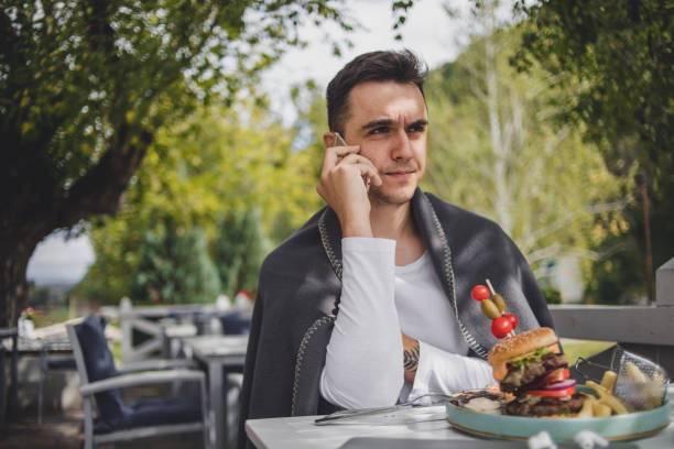 istock I enjoy the taste of this big hamburger 1426353455