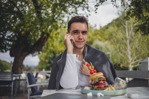 istock I enjoy the taste of this big hamburger 1426354230