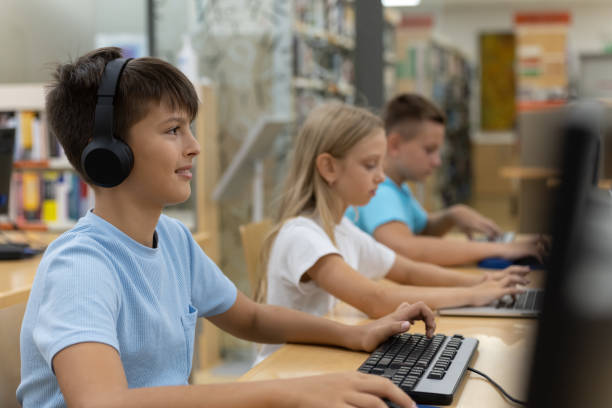 istock Young kids searching for books in the library 1426355407