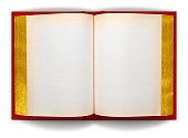 istock Open Red and Gold Book on White with Clipping Paths 1426362234