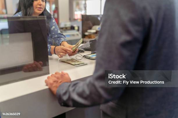 Bank Teller Counting Money For Customer Stock Photo - Download Image Now - Banking, Bank Teller, Paying