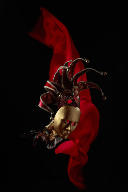 istock Old carnival masks with flutters red cloth. 1426366513
