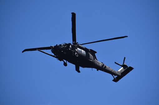 Heavily guarded and armed, Army Helicopters seen over Houston's skies (midday) on September19th, 2022. This is one photo of a set of four.