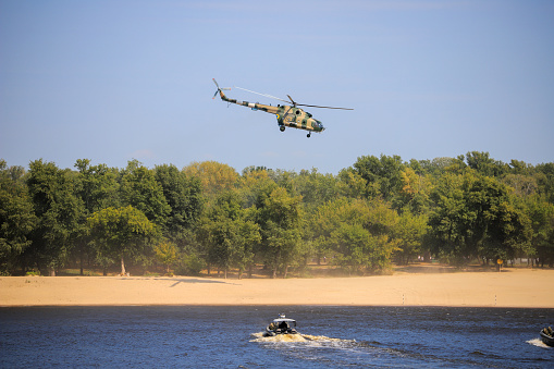 Kyiv, Ukraine - 24 august, 2021: Landing of a Ukrainian military detachment from a helicopter to the shore
