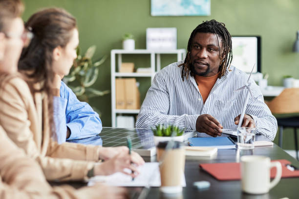 istock Businessman discussing alternative energy with his colleagues 1426373412