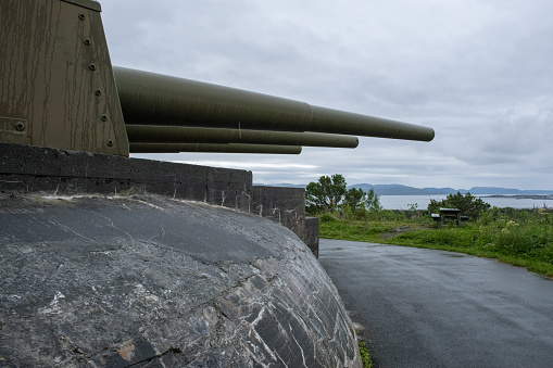 Austratt, Norway - July 06, 2022: Austratt Fort was constructed in 1942 by the Germans and the centrepiece is a triple 28 cm gun turret from the German battleship Gneisenau. Selective focus.