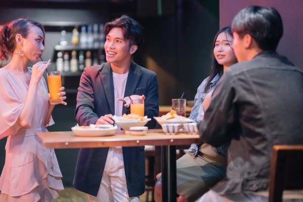 istock group of friends hanging out at pub 1426382589