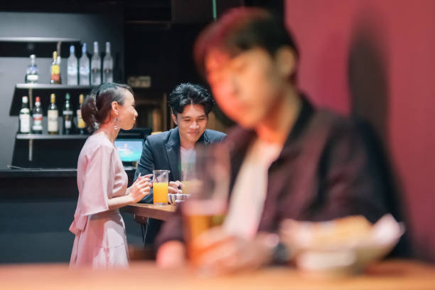 istock group of friends hanging out at pub 1426382669