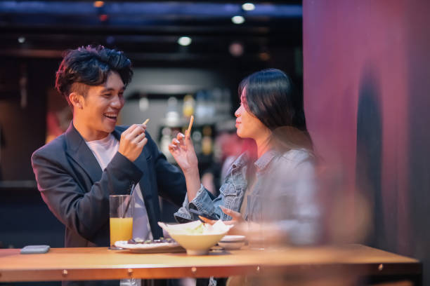 istock couple hanging out at the pub 1426382690