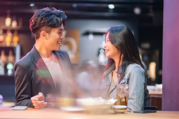 istock couple hanging out at the pub 1426383262