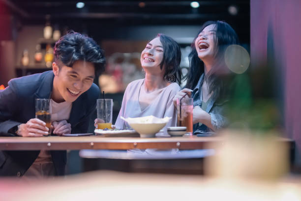 istock group of friends hanging out at pub 1426383806