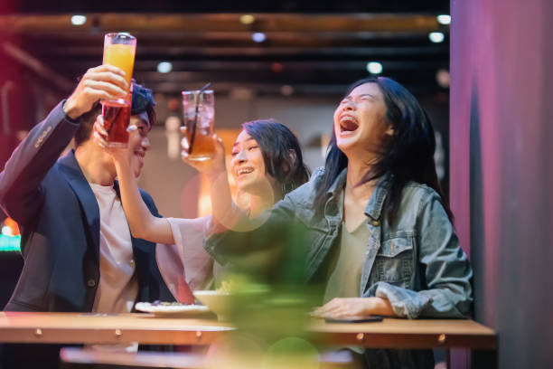 istock group of friends hanging out at pub 1426384330