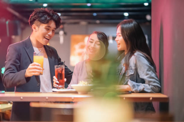 istock group of friends hanging out at pub 1426384335
