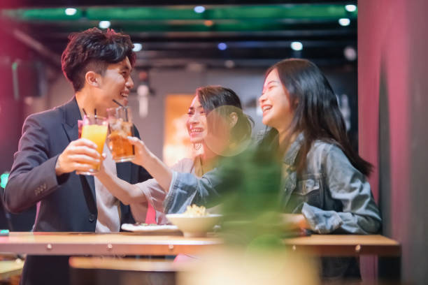 istock group of friend hanging out at pub 1426384446