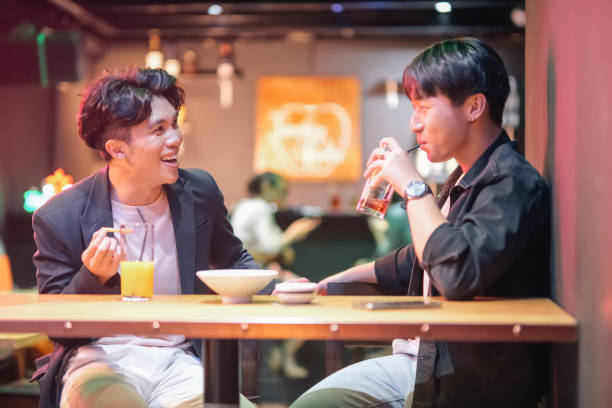 istock guys hanging out in pub 1426384505