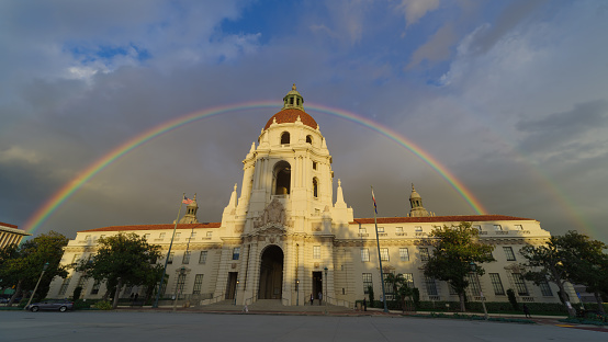 The Pasadena City Hall framed by a double rainbow. Shown in Pasadena, Los Angeles County, California.