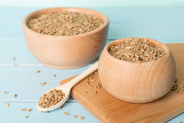 istock Bowls with wholegrain spelt farro on wooden table 1426388582