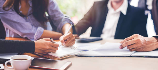 istock Business team meeting or brainstorming and discussing with financial data and analyzing report graph at office. Teamwork meeting and partnership conference working concept 1426392586