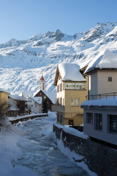 Andermatt Unteralpreuss river flowing through the town center of Andermatt in the Lepontine Alps - Canton of Uri, Switzerland. yt stock pictures, royalty-free photos & images