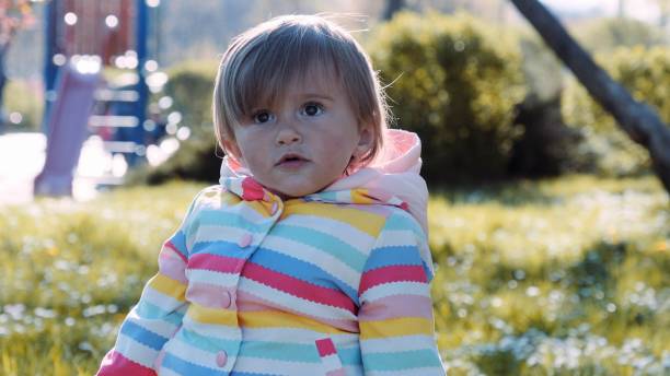 istock Baby plays on the playground at sunset. 1426408153