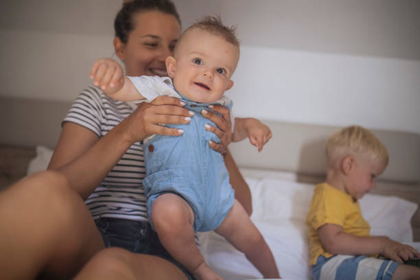 istock Smiling woman having fun with her sons 1426408256