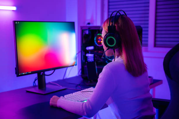 istock Asian professional gamer playing online video game on desktop computer PC have colorful neon LED lights 1426410936