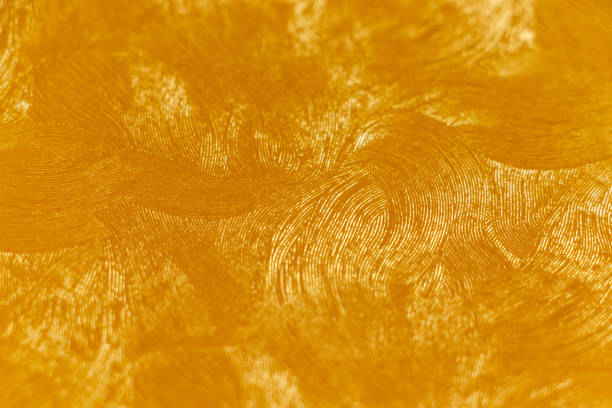 istock Golden wallpaper with fine curved pattern on the surface 1426415471