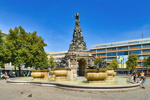 Mannheim, Germany - September 2022: Fountain with sculptures called 'Grupello Pyramid' with sculptures. The Grupello Pyramid is a sculpture on the Paradeplatz in the center of Mannheim. It was created by the Flemish sculptor Gabriel Grupello at the beginning of the 18th century.