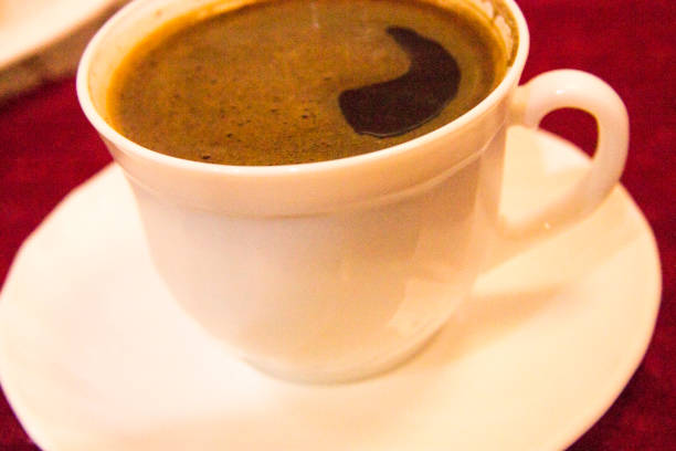 istock Cup of coffee americano in thw white cup on the table 1426451010