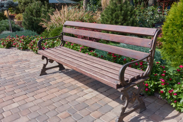 istock Decorated wooden bench in the garden. 1426454709
