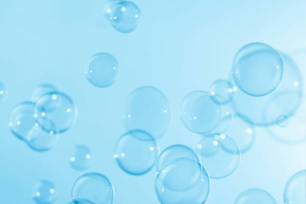 istock Abstract Beautiful Transparent Blue Soap Bubbles Background. Freshing Soap Sud Bubbles Water. 1426454778