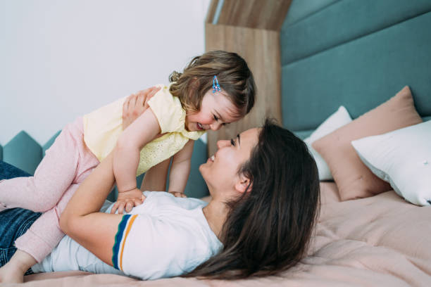 istock Affectionate mother and daughter embracing at home. 1426459349