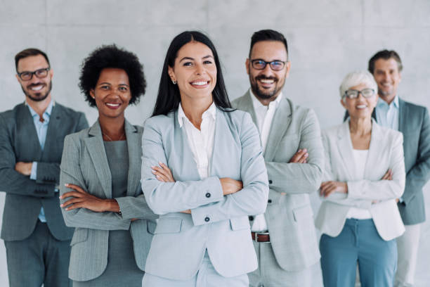 istock Confident businesswoman and her team. 1426459569