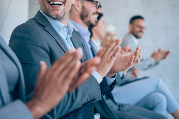 istock Businesspeople applauding during a seminar in conference hall. 1426459575