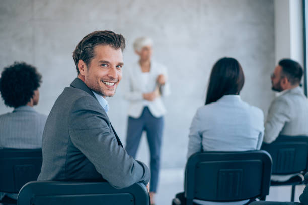 istock Confident businessman attending a seminar. 1426459577