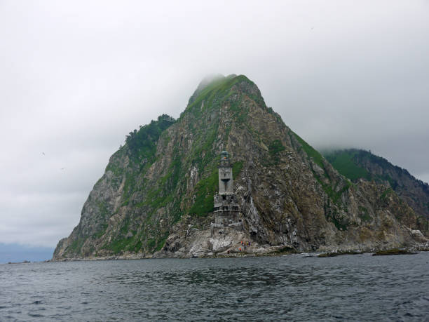 Old ruined lighthouse on the rocky coast