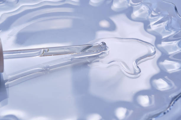 istock Dropper with serum or cosmetic oil on a blue background. 1426465478