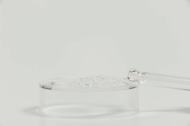 istock Pipette with a glass bottle on a light background. 1426469471