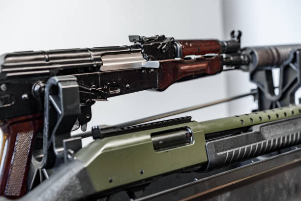 istock Automatic rifle on stand on the table of the weapons workshop. 1426470944