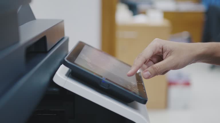 Finger women officer touching screen printer display