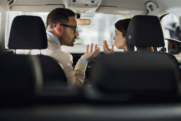 istock Young couple arguing inside of a car. 1426471290