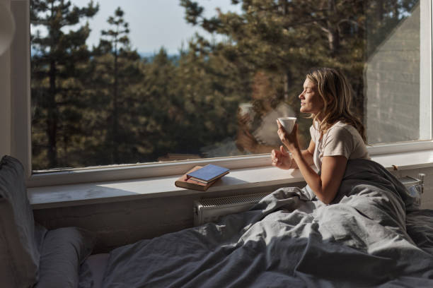 istock Enjoying in morning coffee and sun through bedroom window! 1426471671