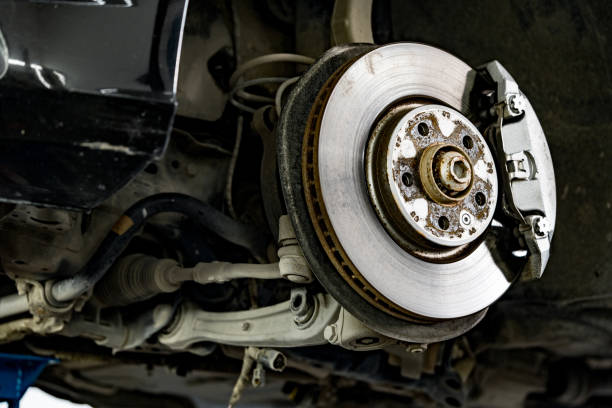 istock Steel brake disc with pad in car service 1426471739