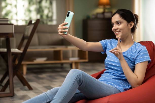 istock Young woman using phone, stock photo 1426472573