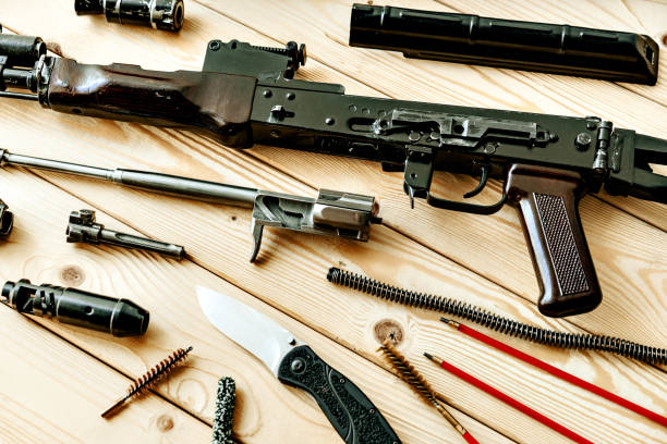 istock Disassembled rifle with cleaning tools on table of weapons workshop 1426472809