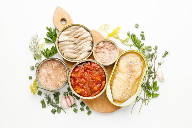 istock Processed fish in tins, canned seafood on a white background. 1426475394
